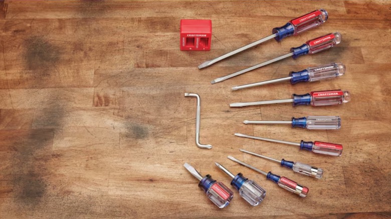 Craftsman screwdriver set in a row on wood table