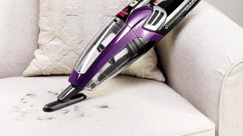 Bissell Pet Hair Eraser vacuum cleaning a sofa