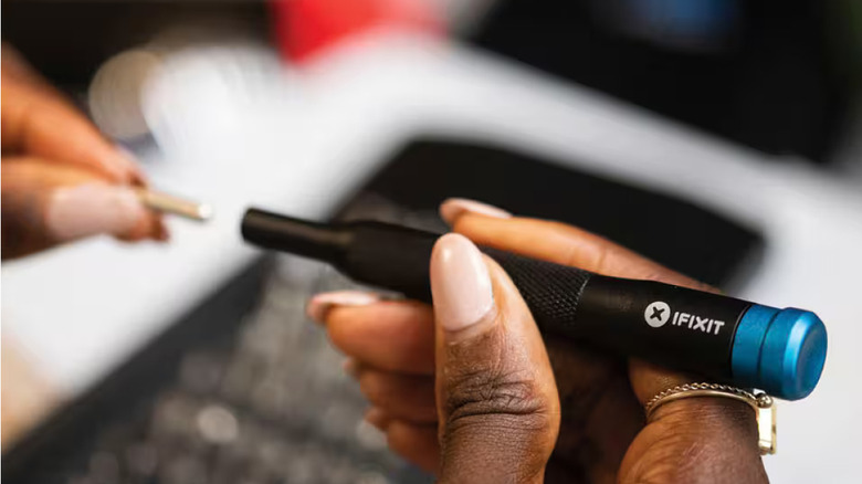 Woman using an iFixit Mako kit