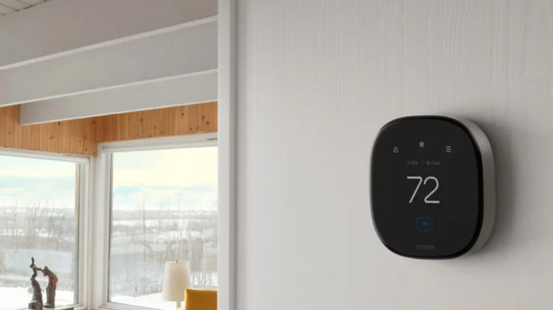 ecobee smart thermostat mounted on wall