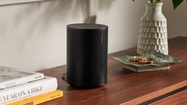Sonos Era 100 speaker sitting on shelf
