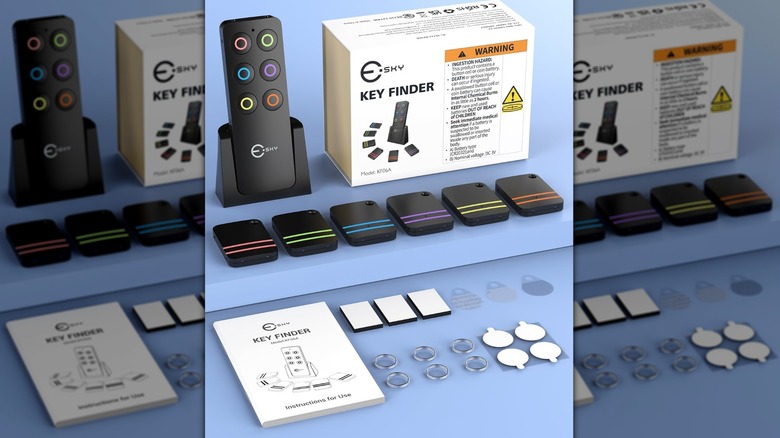 Esky Key Finder box, remote, and receivers laid out on a blue surface