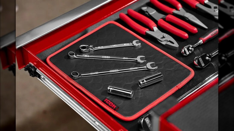 Tools set atop an Icon Magnetic Tool Mat