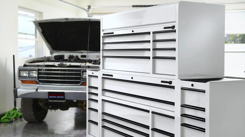 U.S. General 56 x 22-inch Roll Cab (Series 3), Floor Jack, and truck with its hood up in a garage