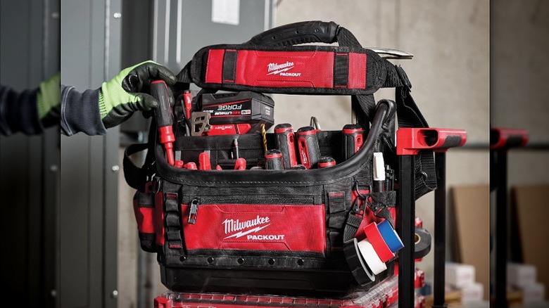 Hand tools and chargers organized in an open-design tote bag.