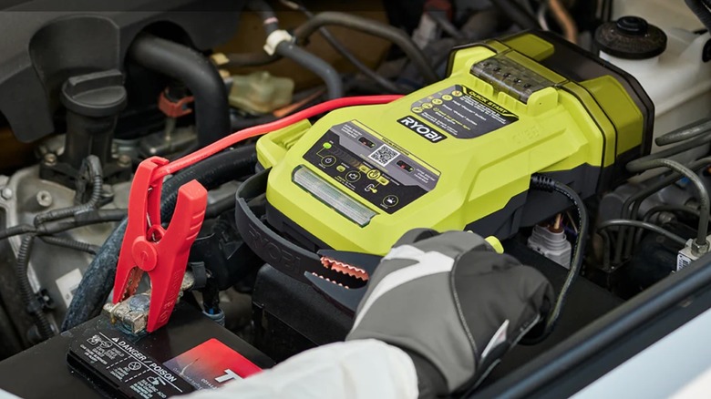 Person using Ryobi jump starter