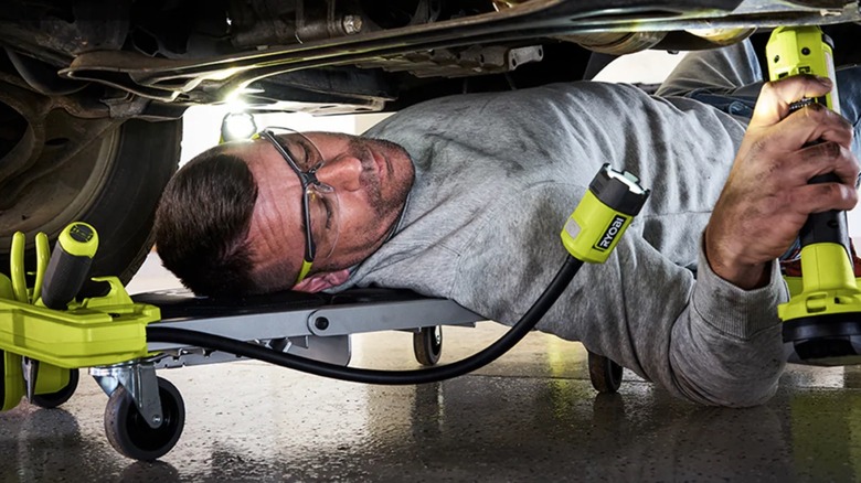Person using Ryobi tools in garage