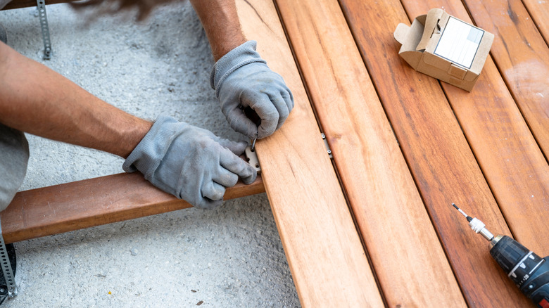Person building a deck