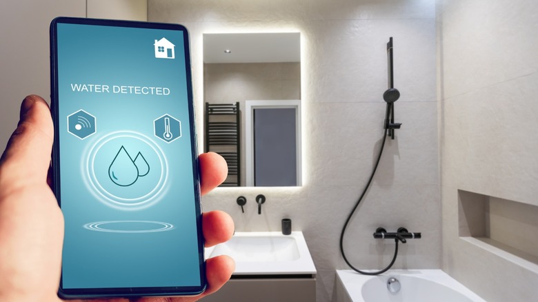 a smart leak sensor installed in a bathroom