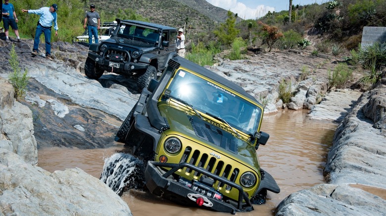 two Jeep Wranglers driving offroad
