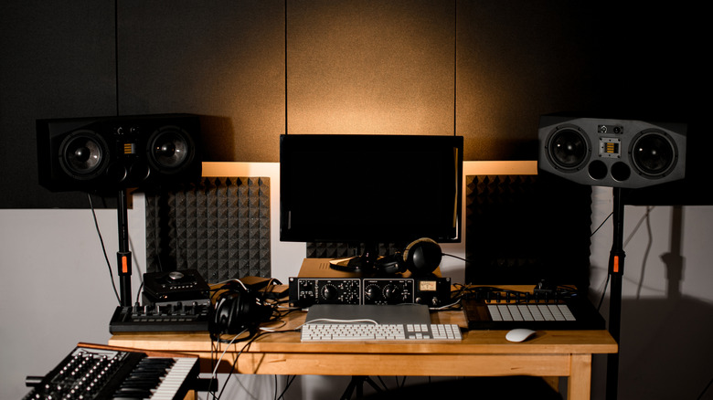 Laptop with speakers and musical setup