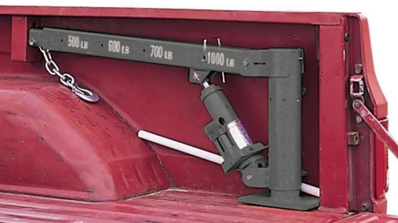 Truck crane tucked over wheel hub