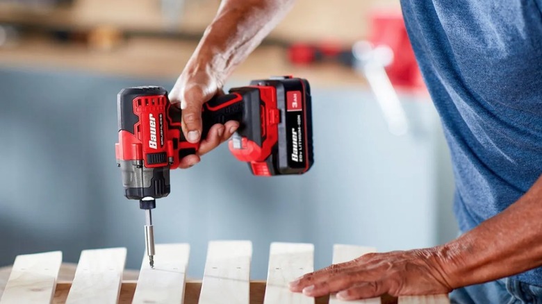Person using Bauer 20V Impact Driver