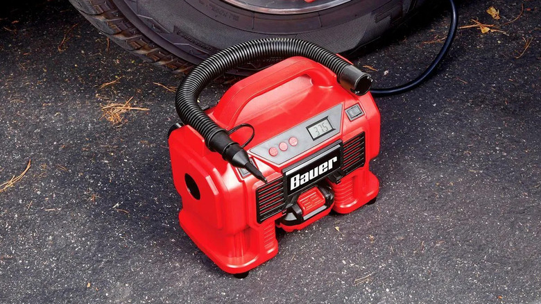 Bauer Cordless Inflator/Deflator used on car wheel
