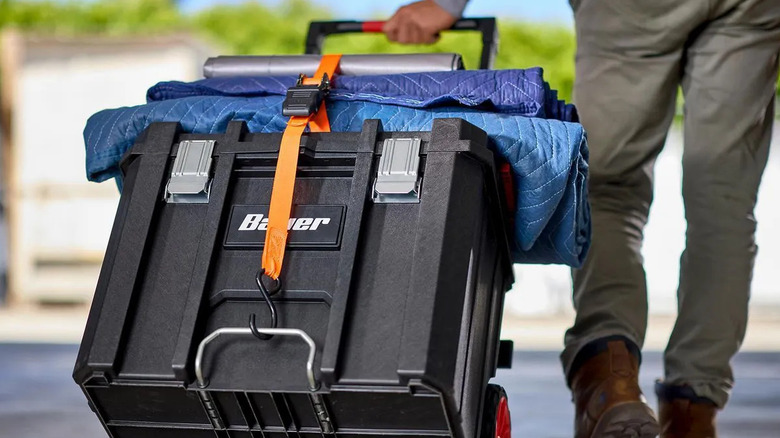 person pulling rolling tool box
