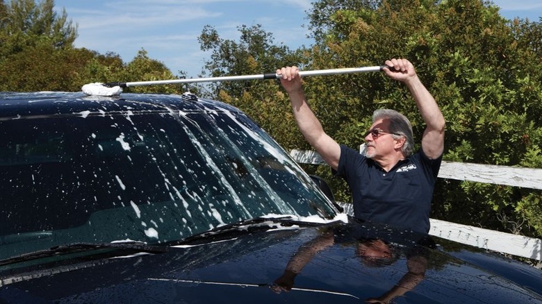 Man with HFT car mop