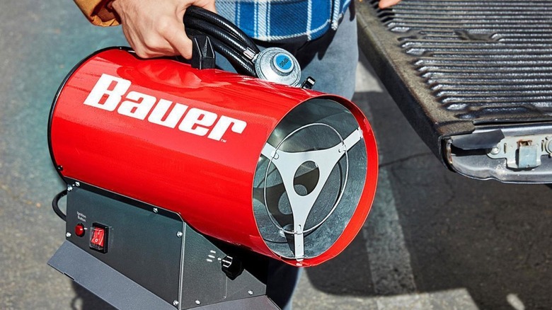 Man holding Bauer heater