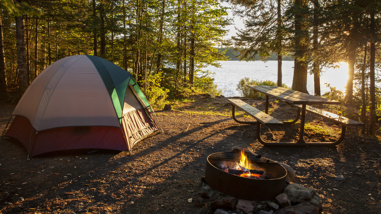 Camping on a lake at sunrise