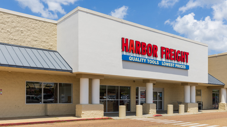 A Harbor Freight store entrance under a blue sky