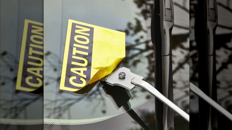 professional scraper used on car window