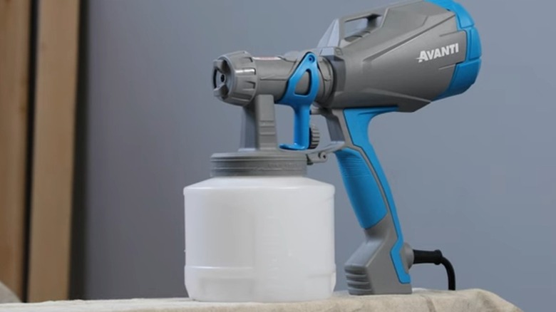 An Avanti paint sprayer standing on a table.