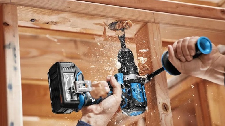 Person drilling into framing with Hercules 20V Brushless 12-inch Drill/Driver