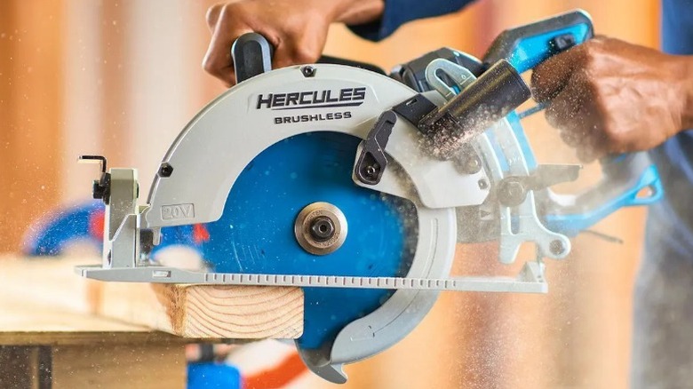 Person cutting 2x4 with Hercules 20V Rear-Handle Circular Saw