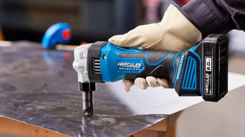 Blue Hercules 16 Gauge Nibbler tools in use