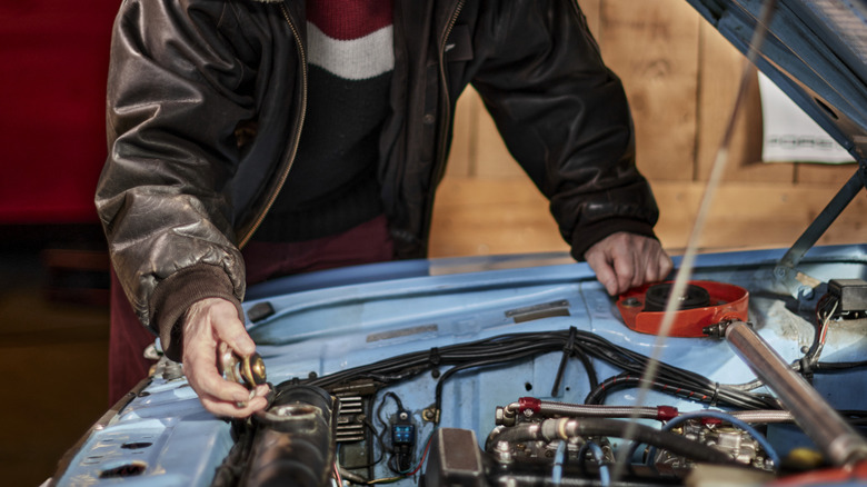 a home mechanic working on a car