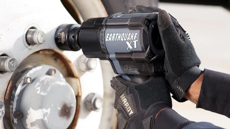 Person using an Earthquake XT impact wrench