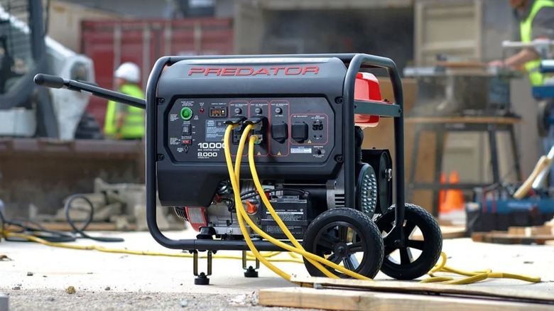Construction workers using Predator generator to power tools on a work site