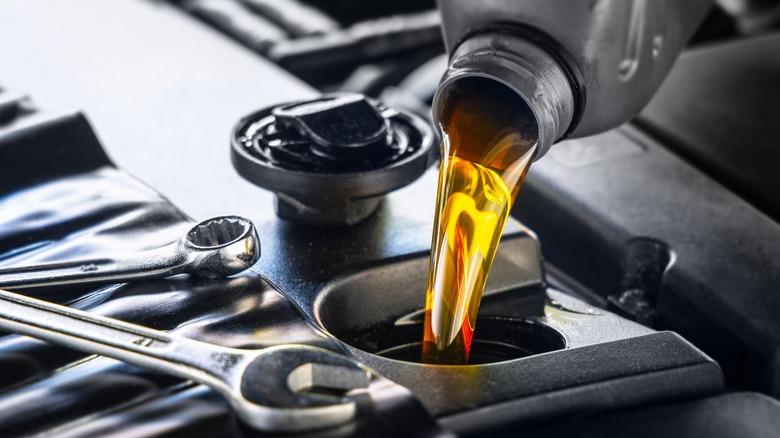 pouring engine oil