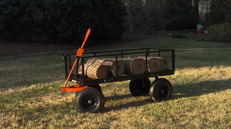Cart with logs in field