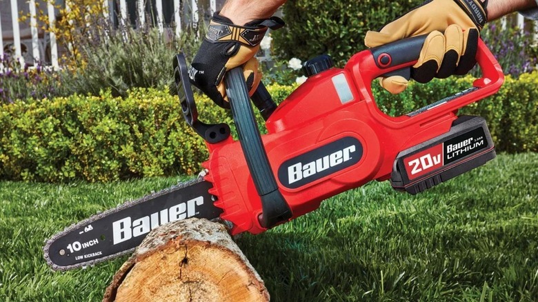 Bauer 10-Inch Chainsaw cutting through log