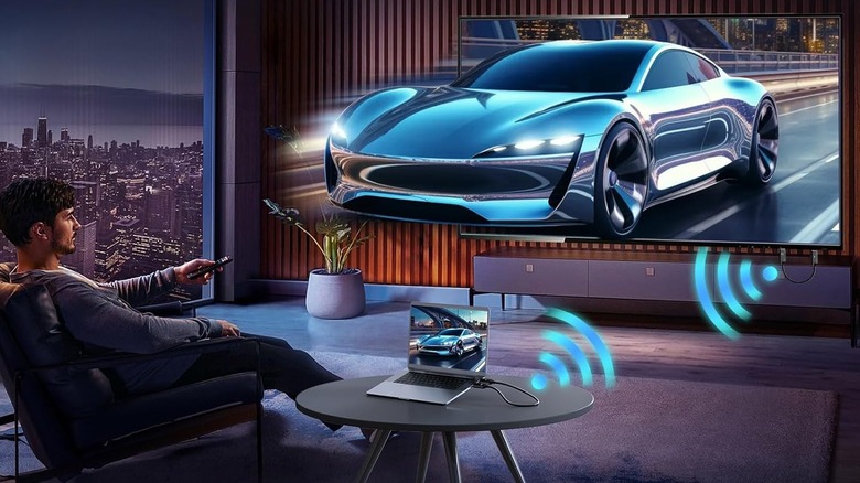 man watching tv with car