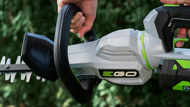 close-up of a person using an Ego Power Plus 26-inch hedge trimmer