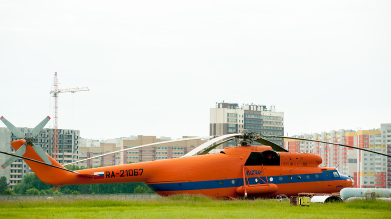Orange Mil Mi-6 helicopter parked