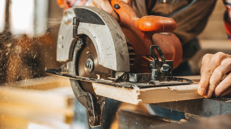 Person using circular saw