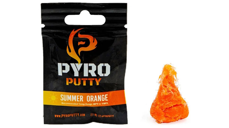 Pouch of Pyro Putty and an example of the orange putty on white background