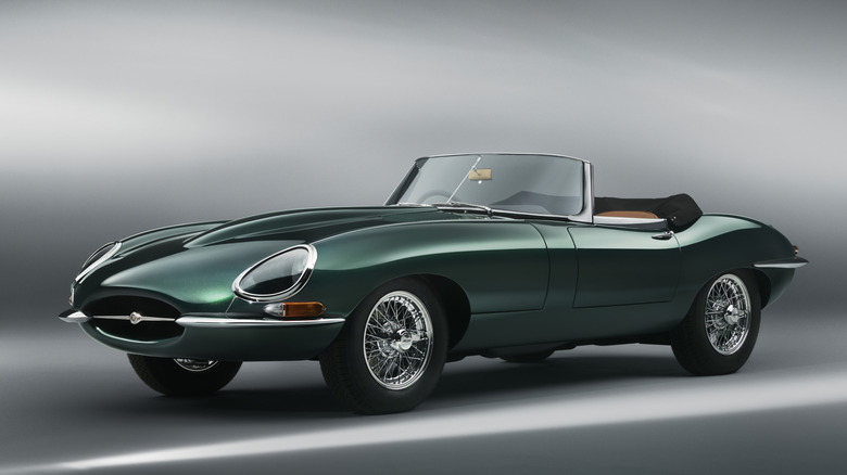Studio photo of a green 1963 Jaguar Series 1 E-Type