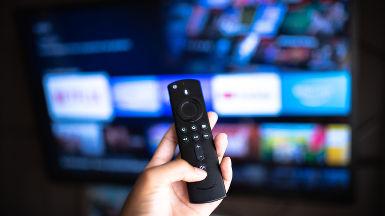 Person holding a Fire TV remote