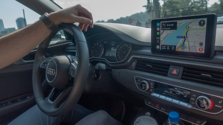 Person using CarPlay navigation