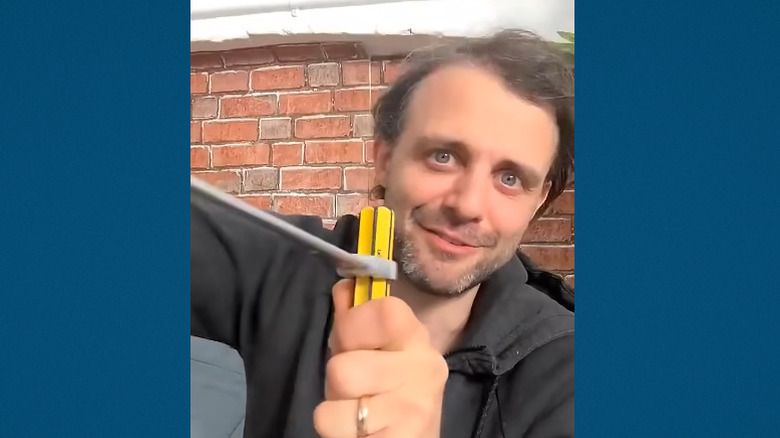 Steve Mould turning a screwdriver with a wrench