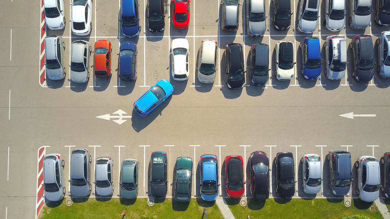 A parking lot with multiple cars.