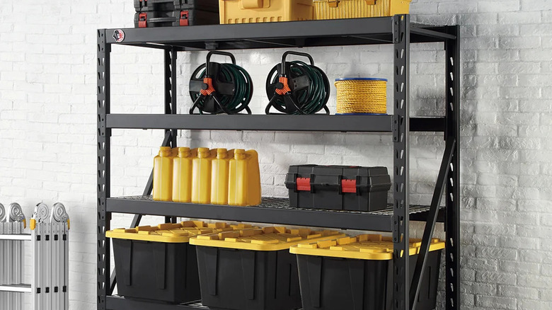 A Gorilla Rack holding bins and tool boxes set against a white brick wall