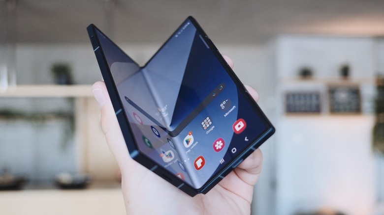 a Samsung Z Fold 6 held in one hand