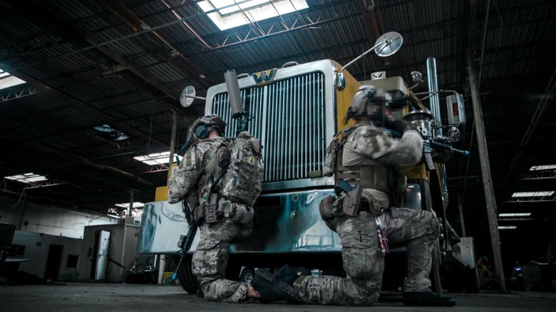 Soldiers using JTWS gear in urban combat