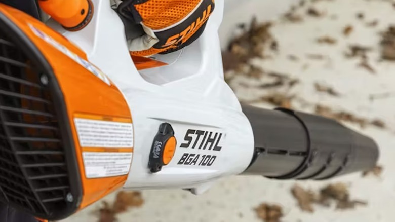 A STIHL Smart Connector attached to a power tool's motor housing.