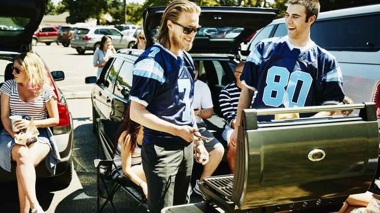 People tailgating cooking food