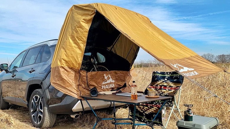 SUV and tent outdoors